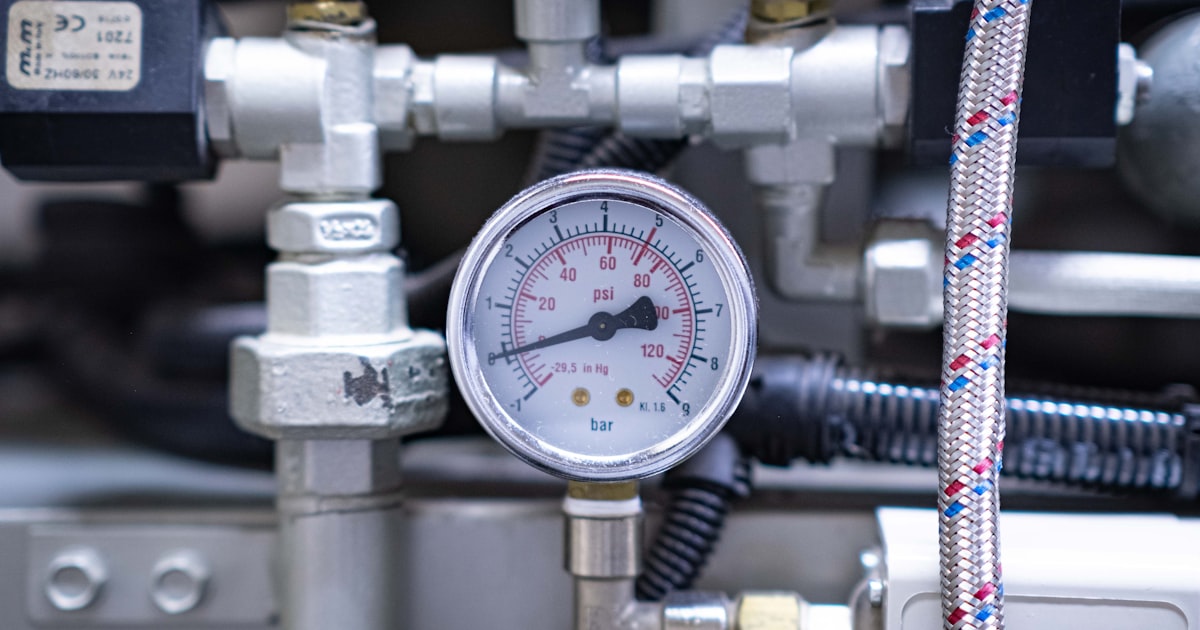 Close up of a precision pressure gauge on a machine