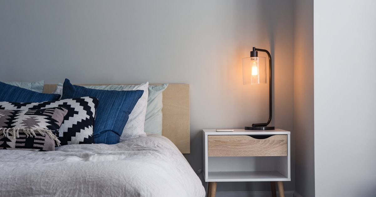 Unmade bed in soft moody light